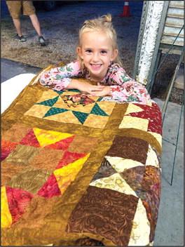 Cara Sue Broyles won this year’s quilt raffle. She used her birthday money to buy tickets. Her great-grandmother, Sue Broyles, was one of the quilters. Submitted by Callie Broyles