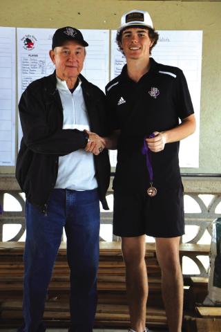 Sr Shooter Wright receiving his 3rd place metal from Coach Schulze