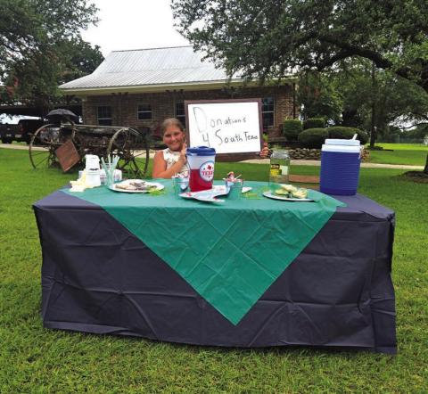 Rayleigh Perry from Burleson manning her “Donations 4 South Texas” Lemonade Stand where she raised over $700 for flood victims.