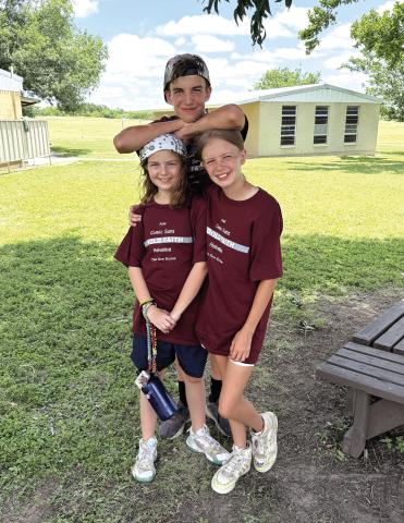 Valerie Valdez took this photo of the three kids at Heart of Texas Bible Camp in Brady. Ann Elise and Emily are in the front, Tilden is in the back.