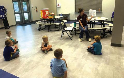 County Extension Agent McKinley Crownover reading to the Cherokee Pre-K kids