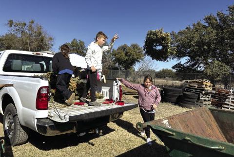 Cherokee ISD GT members Phoebe Valdez, Jaxon Owen, and Addie Merriman removed old wreaths from the cemetery as a community service project. Courtesy Shannon Padgett