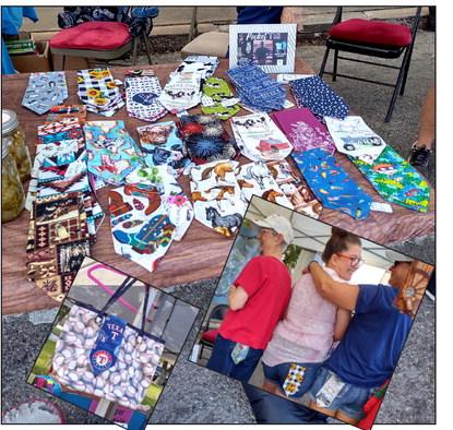 Here is the table display of 'Pocket Ties.' LaRaye Kelly, Tasha Worman and Mary Ferris are wearing them on their back pockets, and you can also see how they can be displayed on bags.