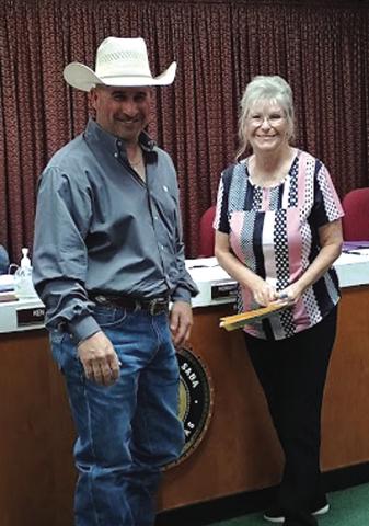 San Saba Justice of the Peace Sharon Blossmen swore in the incoming Chief of Police Stephen Lozano at the City Council meeting last week on July 8, 2025. The meeting was very well attended with standing room only. After the swearing in, a small reception for Chief Lozano was held. Photo by Djuana Payton