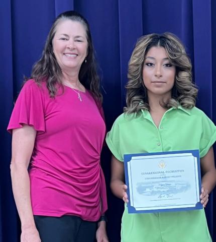 Carol Cunningham from Congressman August Pfluger’s office with Regional Art Winner Kelyn Yanez. | Photo by Shara Wright | TAEA Region 15 Representative