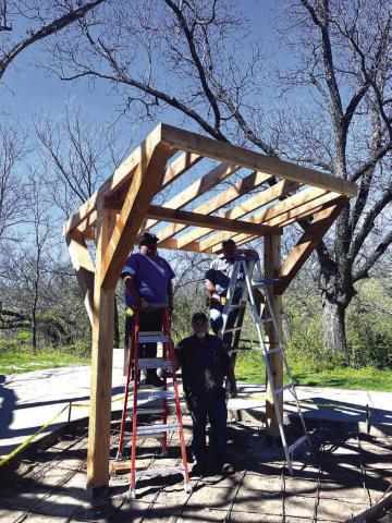 With assistance from LCRA, the City is building this covered bench. As of last week, it was about 50% complete. All that needs to be done is to finish the roof and install the concrete bench. The head carpenter is Norman Pierce (Fleet Maintenance for the City), pictured in the center. Juan Diaz (Parks Department) is on the left, and Chris Stewart (Parks Department) is on the right. Courtesy of Scott Glaze, San Saba Public Works Director
