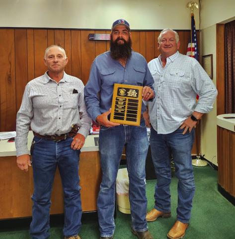 Electric Department Supervisor Denver Daniel (left) and Alderman Shawn Oliver (right) presented Brandon Verette (center) with an “Employee of the Month” designated plaque with his name on it and a gift certificate to a local restaurant. Photo by Djuana Payton