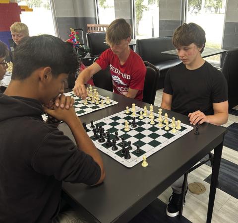 Kam (black hoody) Vince( red T-shirt) CJ (black T-shirt)
