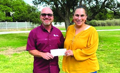 Lehne Project Engineer Stephen Owens presents a check to SSGABB Treasurer, Stephanie Dozier. While attending TexasA&amp;M, Stephen was Head Stack Red Pot for Aggie Bonfire. Gig ‘Em!