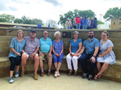 The family of Stan Weik pose near the commemorative plaque on the horseshoe bench in Mill Pond Park in memory and honor of their loved one, Stan, who served as San Saba’s City Manager for 13 years. He was instrumental in developing and guiding many beautification projects in San Saba. The dedication and memorial ceremony took place Friday, April 22nd, and was well attended by the community. (Photo provided by Sarah Saldivar)