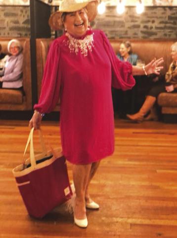 Anita Adams took part in the modelling show and then performed a skit to keep a smile on everyone's face at the Pierian Club November meeting.