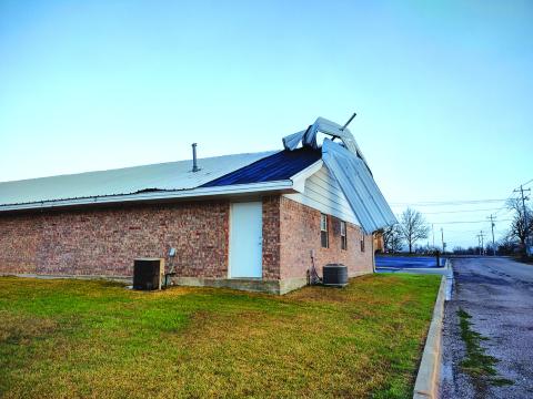 The Father’s House roof shows evidence of the high winds in the storm Monday night. Photo by Djuana Payton