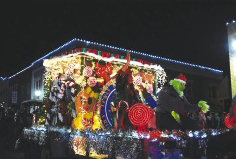 The Grinch riding on the San Saba Street Department Float