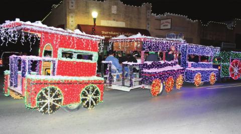 The City’s Electric and Water Departments won “Best in Show” at the Annual Lighted Christmas Parade on Saturday, December 12th. Shown above is the beautiful cars and caboose of the train; the engine was shown in a photo last week. You can tell lots of work, as well as lots of lights, went into this project! Congrats to the City! (Photo by Deryl Hoyt, Jr.)