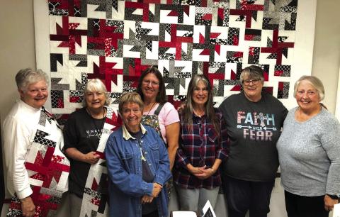 Day one at Cherry Spring Quilt Retreat. The quilt behind us is the Crazy 8 quilt pattern. Pictured front and center, Sue Ransom (Richland Springs, TX). Back row (L-R) Terry Seyler (Center Point, TX), Debbie Phelan (Richland Springs, TX), Toni Hill (Brownwood, TX), Lynda DeGroot (Richland Springs, TX), Kathy Davee (Richland Springs, TX) and Cheri Horning (Center Point, TX) Photo Courtesy of Debbie Phelan