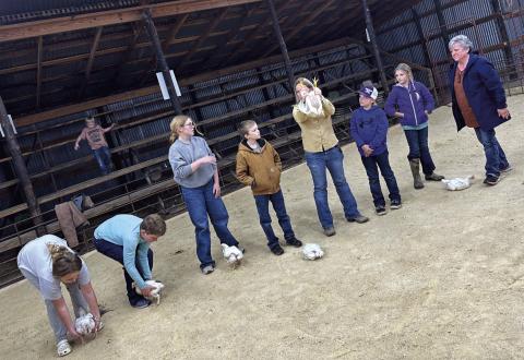Carol Gibson and Kim New help kids at a showmanship clinic Courtesy of Kelly Murray