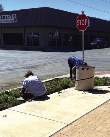 KSSB Board Directors Marcie Butler and Debbie Shahan are shown here cleaning out flower beds at the Visitor's Center. Courtesy of Sarah Saldivar