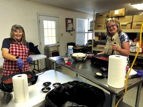 Frankie and Laura are cooking up ground beef.