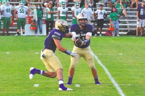 Senior QB #11 - Risien Shahan hands off to Senior #7 Stone Sears.