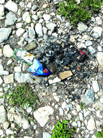 Remnants of a campfire left behind at Maxwell Crossing