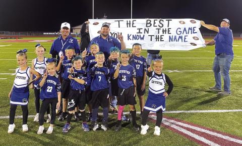 Front row (L to R): Rachel McKinnerney, Tinley Roberson, Bo Taylor, Tyler Fraizer, and Hadley Taylor. Middle row: Bexley Barclift, Bryer Stuart, Lucas Oldham, Zane Woerndell, and Liam Cervantes. Back row coaches: Bobby Deeds, Bo Stuart (Head Coach), and Alex Oldham. Not Pictured: Cheerleaders - Reese Eckert, Ireland Rogers, Zoe Poe, Paisely Hamer and Cheer Coach - Courtney Roberson. Courtesy of Kendra Oldham
