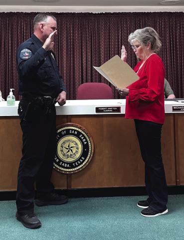 Steven Newkirk being sworn in by Judge Sharon Blossman as the new Chief of Police for San Saba
