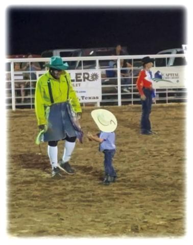 So – what do you do while everybody is chasing a goat? You talk to Leon Coffee! Here’s Holden Henslee, (grandson of Bob &amp; Martha Leigh Whitten), and son of Brian and Margaret Henslee. Big Talking going on for sure! Submitted by Dora C. Miller