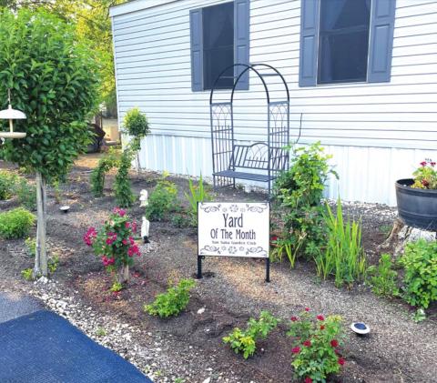 Above is May’s Yard of the Month chosed by the Garden Club. Mrs. Francisca Esquivel and her son, Rigo, live at 1202 West Brown. (Photo by Marissa Kilman)