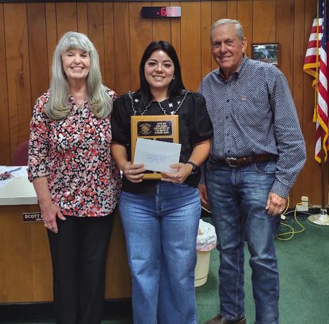 Utility Coordinator Bridgett Macedo (center) was selected as the Employee of the Month for May of 2025. Bridget was presented with a dedicated plaque with her name on it and was given a gift certificate to a local restaurant. Taking part in the presentation were City Treasurer Charlene Lindsay (left) and Mayor Ken Jordon (right). | Photo by Djuana Payton