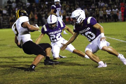 Christian Reyes (#22) and Winton Lackey (#10) break down to make a team tackle. Courtesy of Kayti Lackey - 1916 Athletics