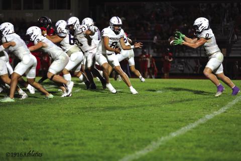 #8 JJ Romero pitching the ball back to #0 Jason Everett who had 23 carries for 101 yards rushing
