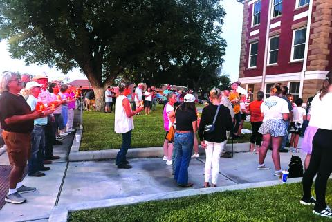 Seen here is part of the 200+ crowd that gathered on Tuesday, September 16th, to honor the memory of the late Charlie Kirk and his beliefs, values, and principles that he demonstrated in his life. This photo shows the Candle Light Ceremony taking place. Photo by Kenneth Pierce