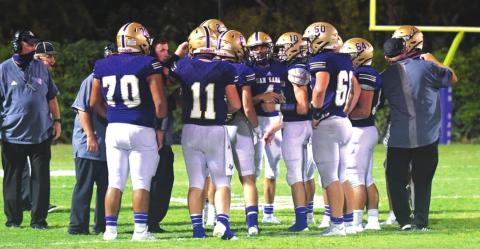 The San Saba High School varsity football team gathers together during a timeout on September 4, 2020, while playing a non-district home game vs. Rogers High School. (Photo courtesy of Rita Boultinghouse)