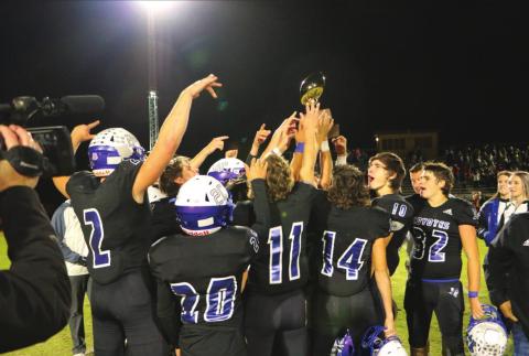Richland Springs HS Coyotes proudly uplift the Area trophy after winning against the Oglesby Tigers last Friday, November 19th. Final score was 53-0. Region IV Final to be played at 7 p.m. on Friday, November 26th against Oakwood High School at neutral site Hico High School. (Photo by Pam Starr)