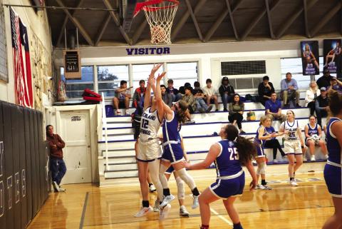 Lady Coyote #12 Flora Appleton straining for the rebound with #25 Calyn Kubin in the background in last week’s game against Cherokee. Courtesy of Pam Starr