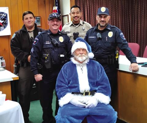 San Saba Police Dept. (L-R): San Saba Game Warden, Mason Murr; Police Sgt., Ty Mann; Game Warden, Ruben Aquilar; Chief of Police, Stephen Lozano; and Blue Santa, Sgt. Charlie Boyce. Photo by Carolyn Preece
