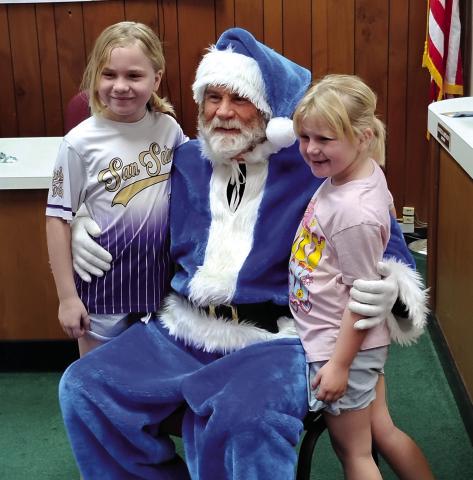 Gentry Bohannon and Huntleigh Bohannon tell Santa what they want for Christmas. Photo by Carolyn Preece