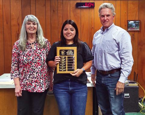 Bridget Macedo, Utility Billing Coordinator, was named Employee of the Month for June 2024. Her supervisor, City Treasurer Charlene Lindsay, and Alderman Marcus Amthor took part in the presentation. Bridget is seen here holding a dedicated plaque with her name on it. She was also presented with a gift certificate to a local restaurant.
