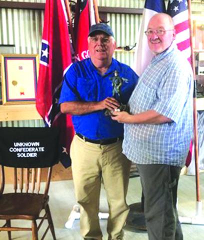SCV Camp Commander Michael Oliver (R) presents a firstplace trophy, a stature of Robert E. Lee, to John Anderson, the first place winner of the black powder turkey shoot held on Saturday, October 5th.